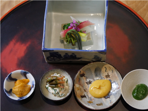 Mountain vegetables, bottarga (cured mullet roe) rice cake, Japanese spiny lobster from Sato in Kokura